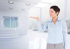 Businesswoman and bright office background