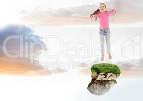 Young Girl jumping on floating rock platform  in sky