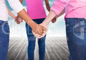 Breast cancer women  putting hands together with sky clouds background