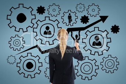 Business woman interacting with people in cogs graphics against blue background