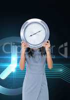 Business woman holding a clock against background with clock