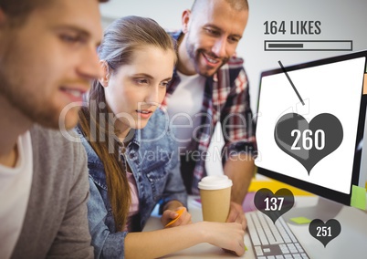 People working on computer with likes status bars  at meeting