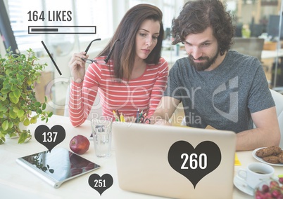 Couple on laptop with likes status bars