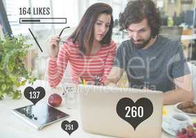 Couple on laptop with likes status bars