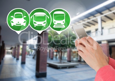 Transport Icons and hand holding phone in station
