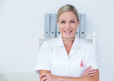 Doctor woman with breast cancer awareness ribbon