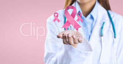 Doctor woman with breast cancer awareness ribbons