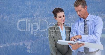 Business people in front of forest