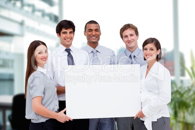 Business people holding blank card in office