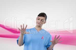 Doctor woman with breast cancer awareness ribbon