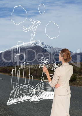 Business woman drawing travel icons on the road