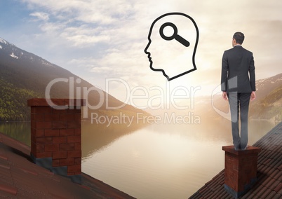 Head with magnifying glass search icon and Businessman standing on Roofs with chimney and lake mount