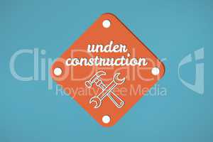 Under construction text with tools graphics in a sign against blue background