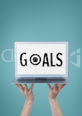 Business woman holding a computer with goals text