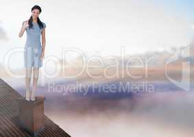 Businesswoman standing on Roof with chimney and colorful sky