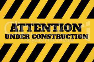 Under construction text against yellow and black background