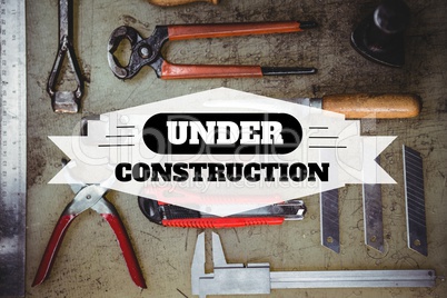 Under construction text against tools photo