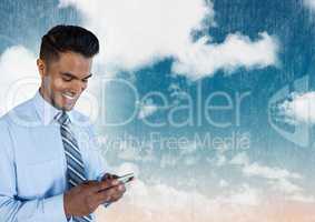 Businessman on phone under sky clouds
