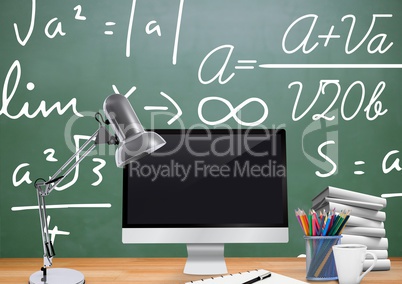 Computer Desk foreground with blackboard graphics of formulas