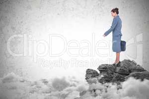 Composite image of businesswoman standing isolated on white background