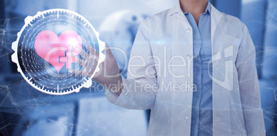 Composite image of midsection of female doctor using digital screen