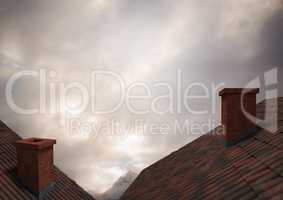 Roofs with chimney and clouds