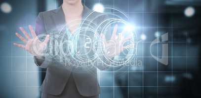 Composite image of businesswoman using digital screen