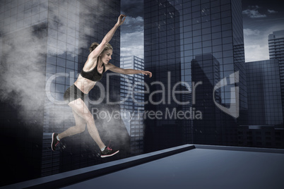 Composite image of athletic woman exercising on white background