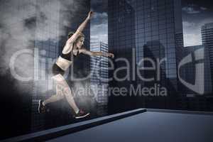 Composite image of athletic woman exercising on white background