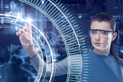 Composite image of beautiful woman using virtual reality glasses