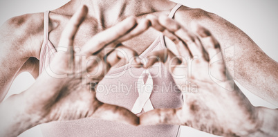 Woman wearing pink ribbon for breast cancer awareness