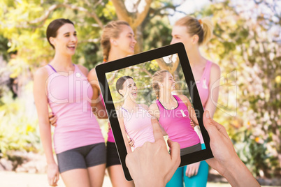 Composite image of hands touching digital tablet against white background