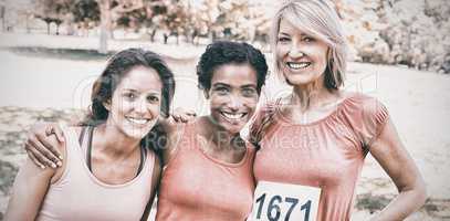 Happy women participating in breast cancer marathon