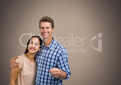 Couple Holding key in front of vignette