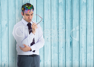 man thinking with colour letters on head