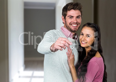 Couple Holding Keys at home