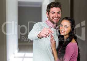 Couple Holding Keys at home