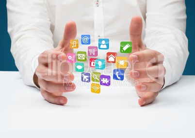 hands with application icons in the desk. Blue background