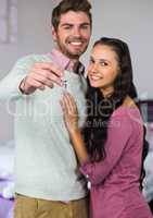 Couple Holding key in home