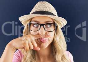 Millennials girl with mustache drawn on finger against blue background with white vignette