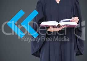 Judge mid section with book and blue arrow against grey background
