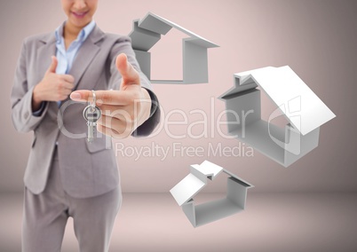 Woman Holding keys with house home icons in front of vignette