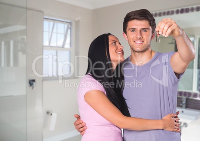 Couple Holding key in bathroom