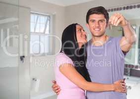 Couple Holding key in bathroom