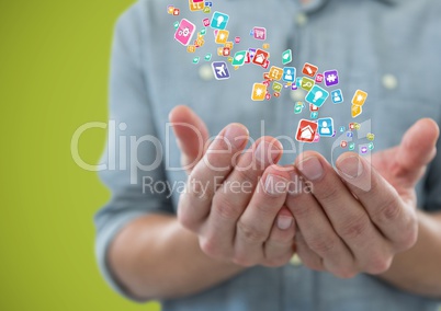 hands  with application icons over. Green background