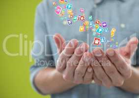 hands  with application icons over. Green background