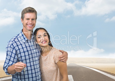 Couple  Holding key in front of road