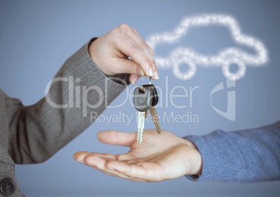 Hands Holding key with car icon in front of vignette