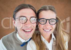 Close up of nerd couple against brown background with grunge overlay