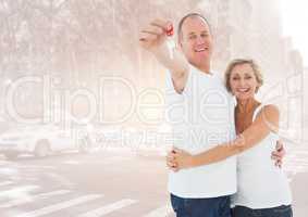 Couple  Holding key in front of street